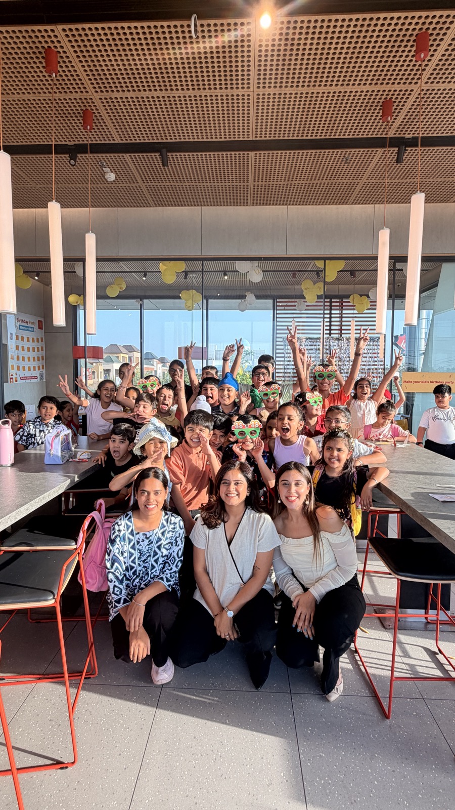 Team and students celebrating together at a party